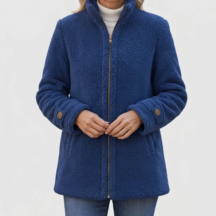 Blue fleece jacket on an off-gray studio background - 2