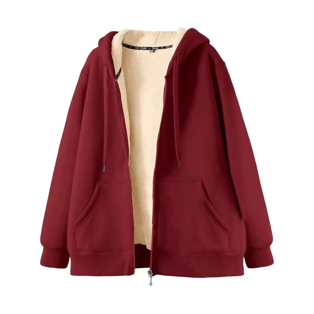 Flat lay of a maroon zip-up hoodie, partially unzipped to reveal its cream-colored fleece lining and front pockets.