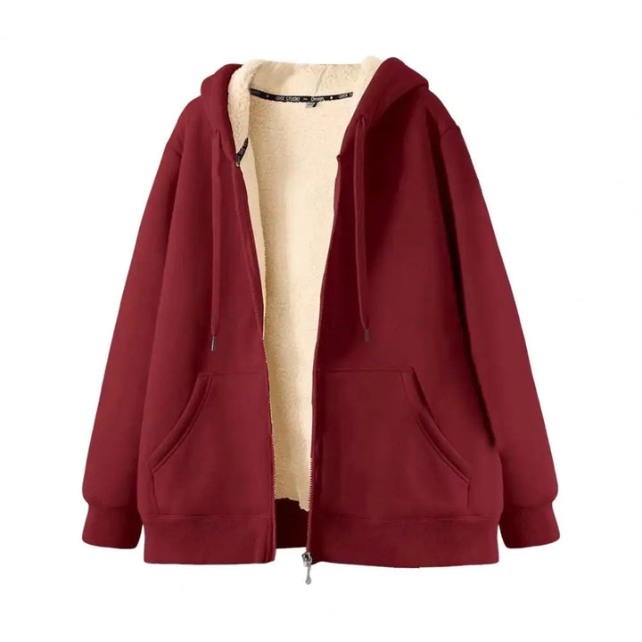 Flat lay of a maroon zip-up hoodie, partially unzipped to reveal its cream-colored fleece lining and front pockets.