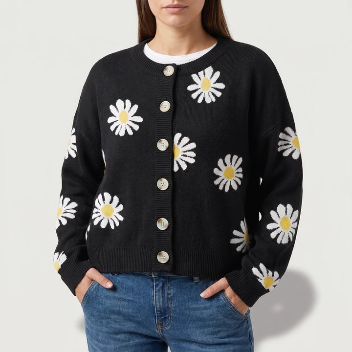 Black knit cardigan on an off-gray studio background