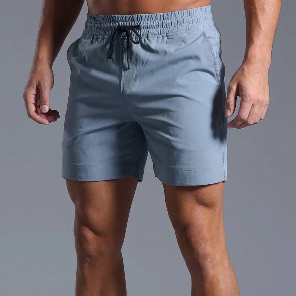 Whitlock muted blue-gray athletic shorts on model