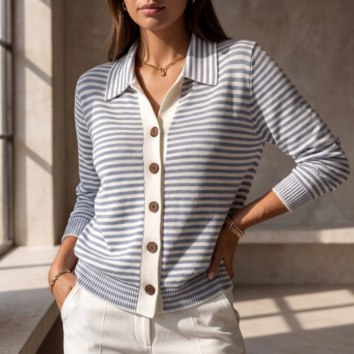 Woman wearing a blue and white striped knit cardigan with an off-white placket, brown buttons, and a collar.
