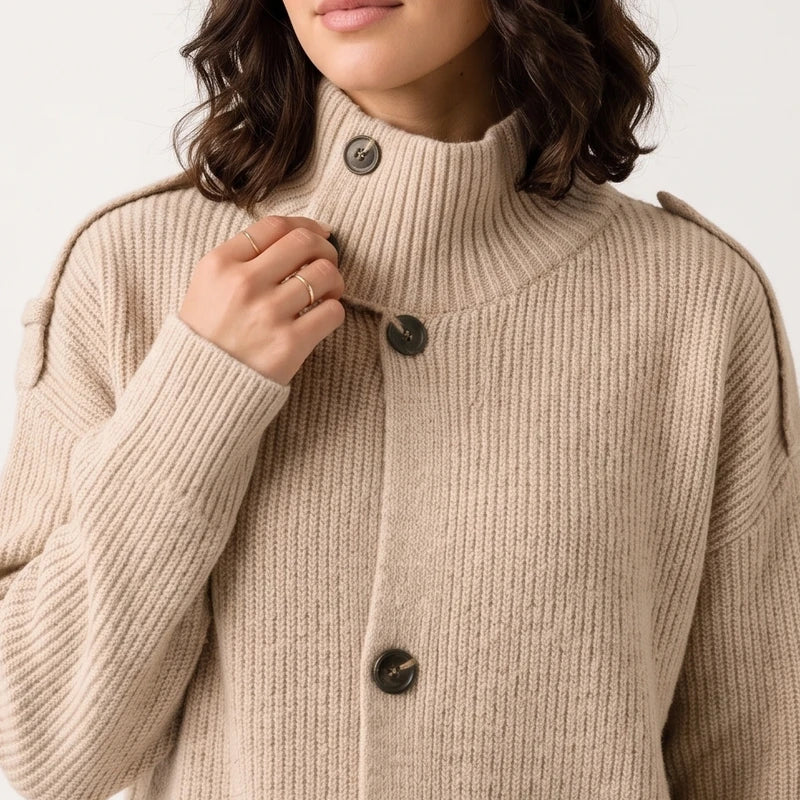 Apricot knit cardigan on an off-gray studio background - 2