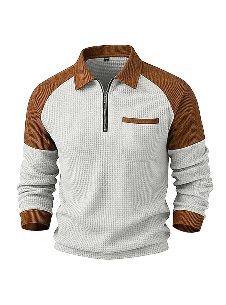 Two-tone half-zip waffle knit pullover in white and brown, featuring a collar, chest pocket, and ribbed cuffs.