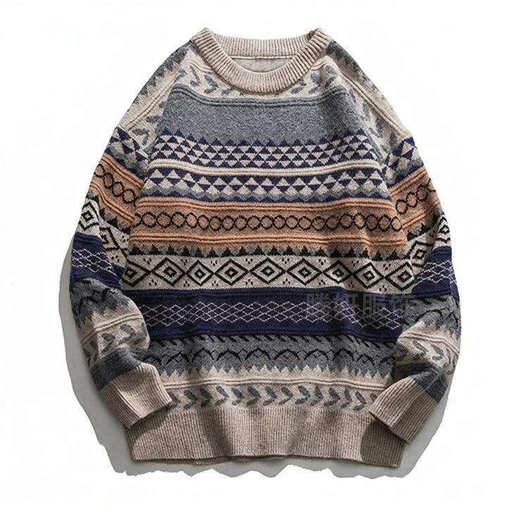 Crew neck knit sweater with geometric patterns in beige, blue, terracotta, and grey, laid flat on a white background.