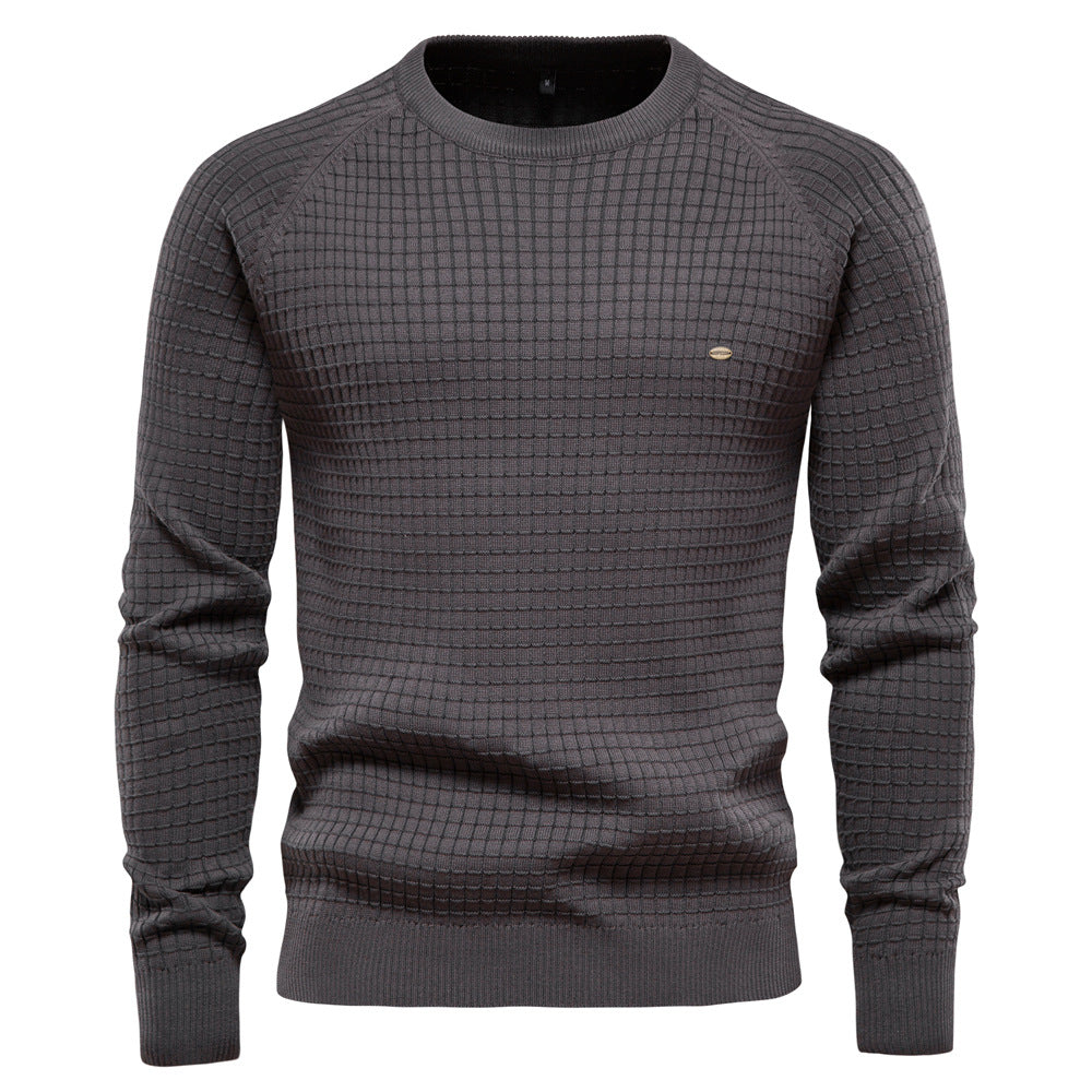 Dark gray knit sweater featuring a subtle grid texture pattern and ribbed cuffs and hem, shown on a white background.
