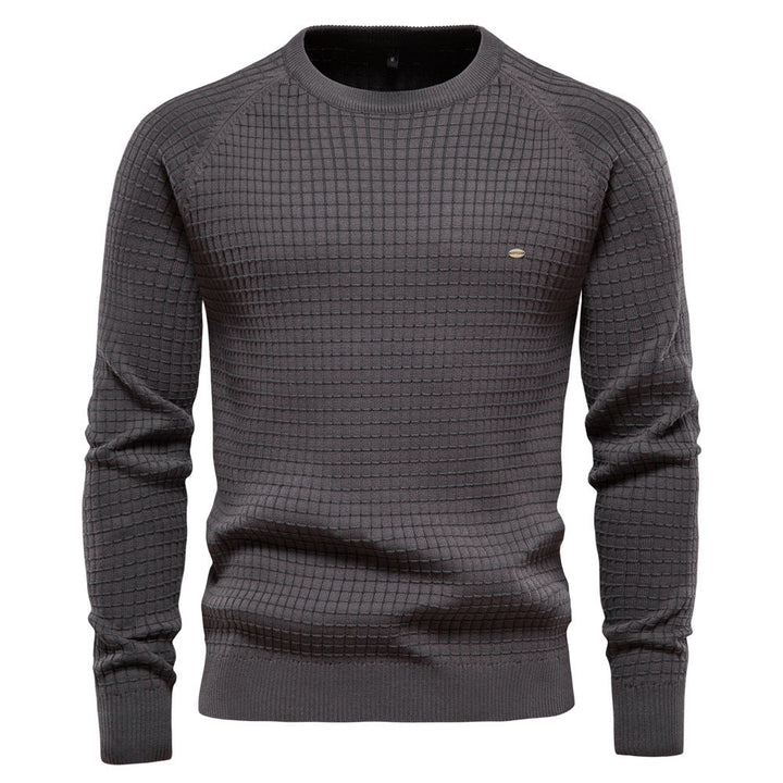 Dark gray knit sweater featuring a subtle grid texture pattern and ribbed cuffs and hem, shown on a white background.