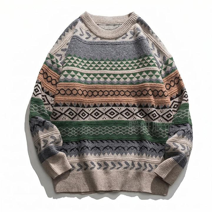 Flat lay of a beige, grey, and green knit sweater featuring a geometric, fair isle pattern with black and brown accents.