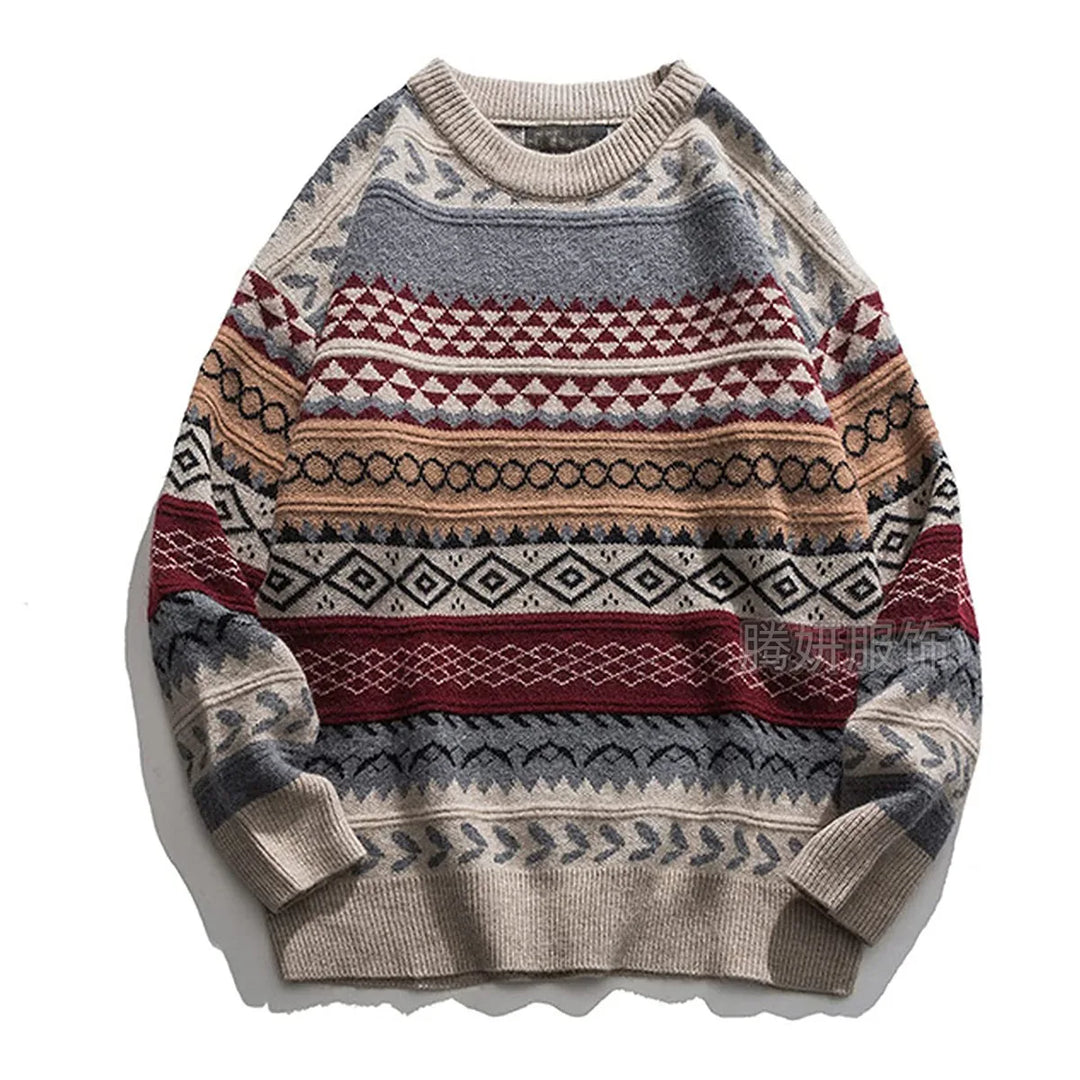 Flat lay of a chunky knit sweater featuring geometric patterns in beige, grey, red, and tan.