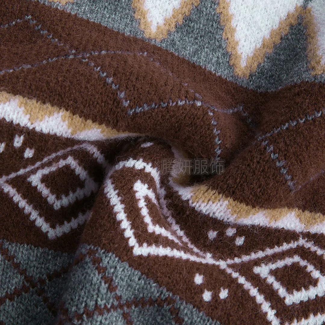 Close-up of a brown, white, gray, and tan fuzzy knit sweater with argyle-like diamond patterns and visible texture.