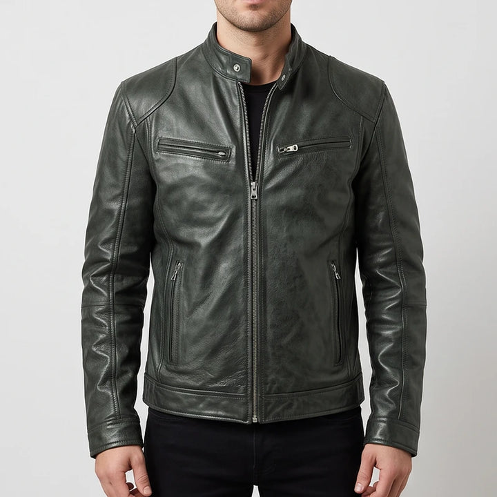 Man wearing a dark charcoal leather biker jacket with front zip pockets and a snap collar against a plain white background.