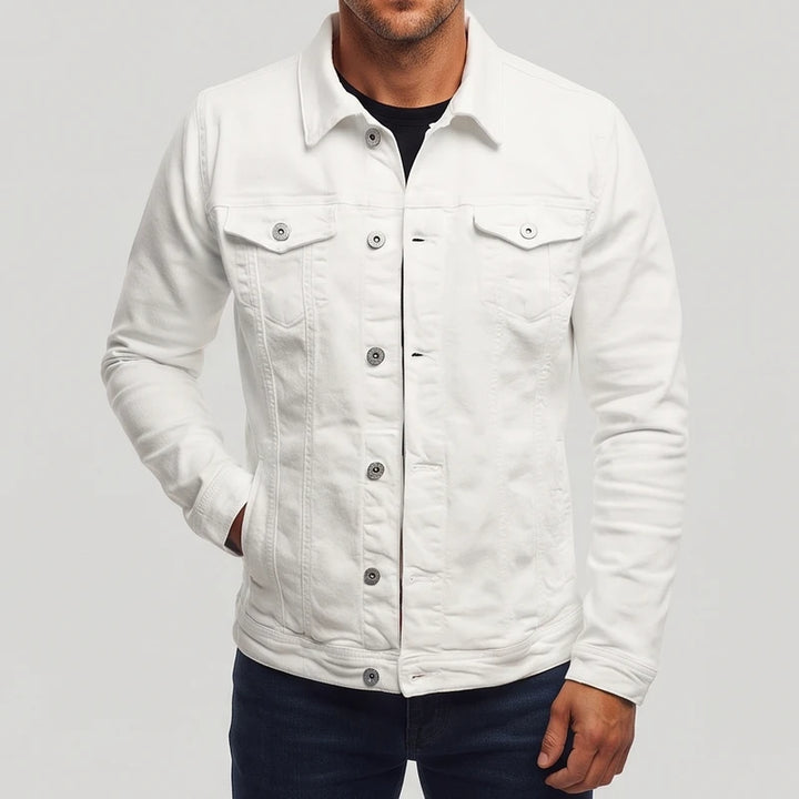 Man wearing a white long-sleeve denim jacket with silver buttons, chest pockets, and a pointed collar, on a gray background.