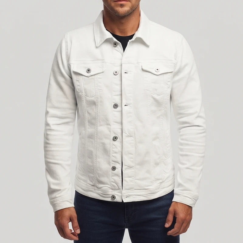 Man wearing a white long-sleeve denim jacket with silver buttons, chest pockets, and a pointed collar over a dark shirt.