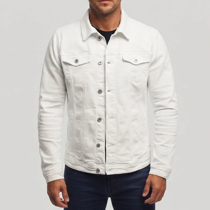Man wearing a white long-sleeve denim jacket with silver buttons, chest pockets, and a pointed collar over a dark shirt.