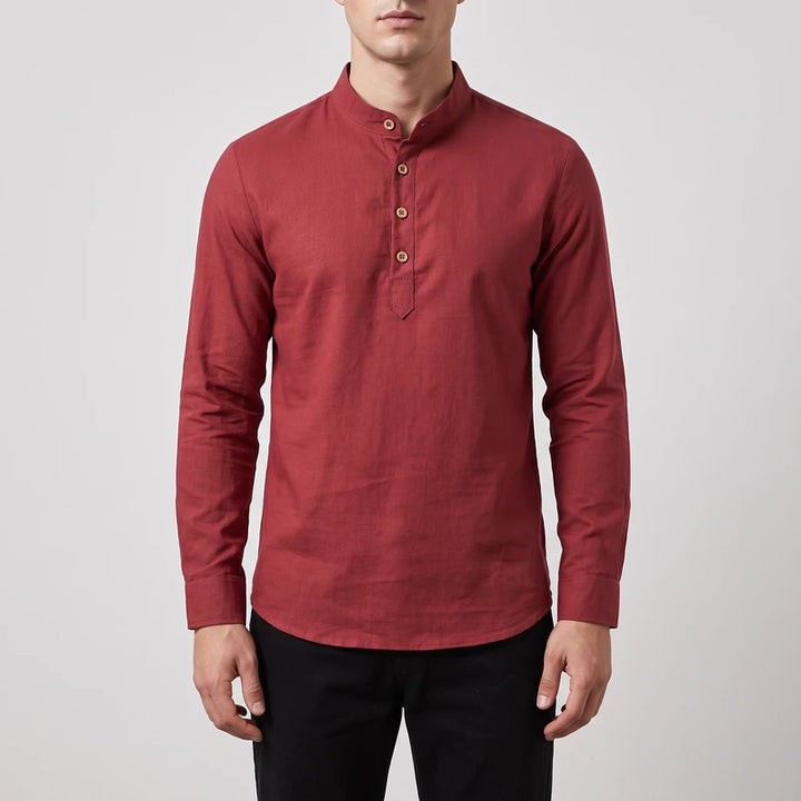 Man wearing a reddish-brown long sleeve shirt with a mandarin collar, buttoned placket, and light wooden buttons.