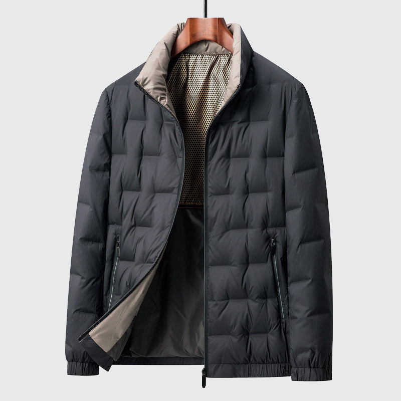 Dark gray quilted puffer jacket with a stand-up beige collar and visible mesh inner lining, displayed on a wooden hanger.