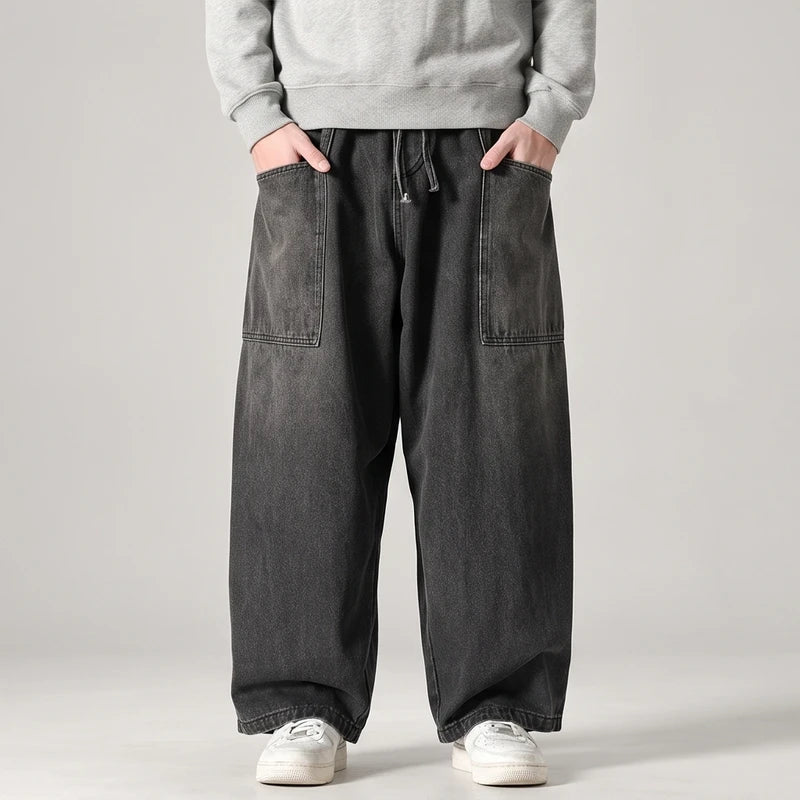 Black jeans on an off-gray studio background - 2
