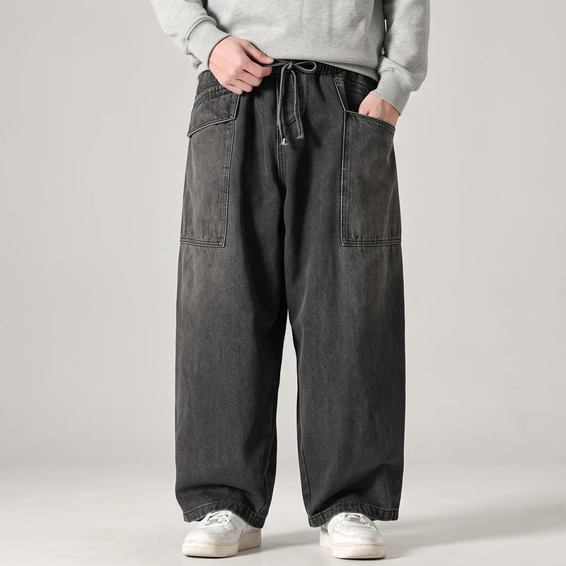 Black jeans on an off-gray studio background - 3