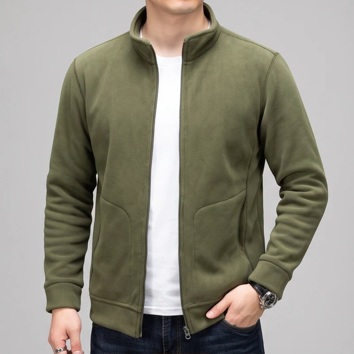 Olive Green fleece jacket on an off-gray studio background