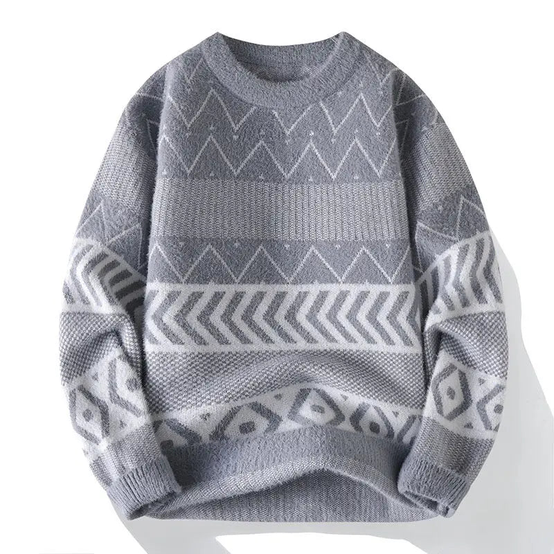 Flat lay of a soft gray knit sweater with a crew neck and white geometric patterns on the body and sleeves.