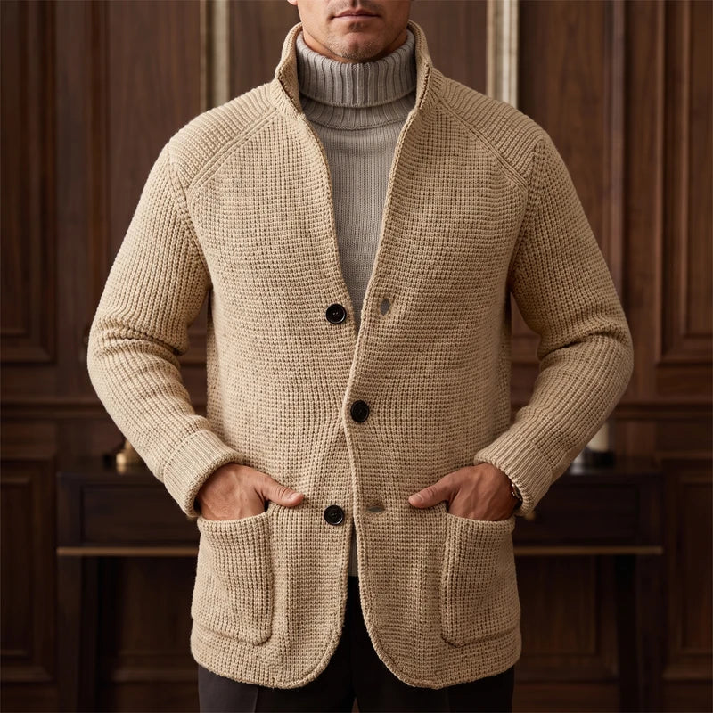 Beige knit cardigan in a dark wood interior