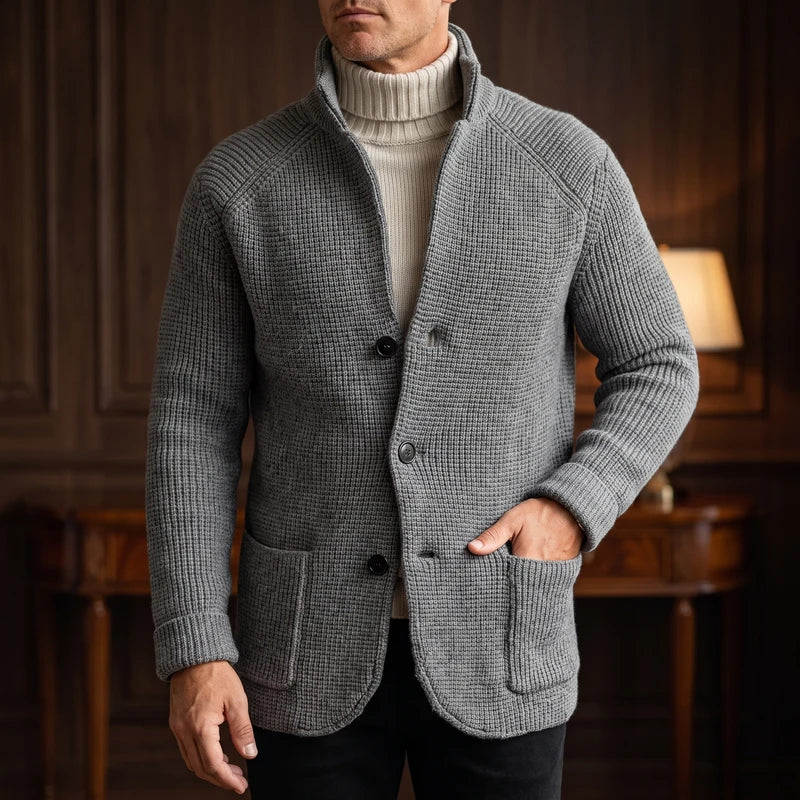 Gray knit cardigan in a dark wood interior