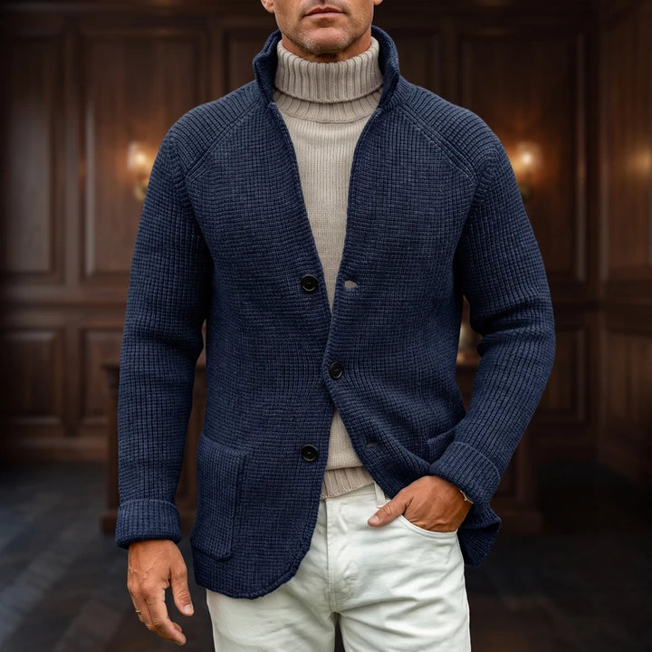 Navy knit cardigan in a dark wood interior