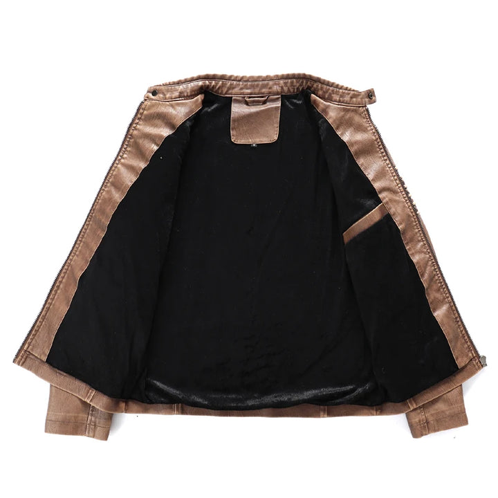 Flat lay of an open brown leather jacket, revealing its black plush lining and an interior pocket.