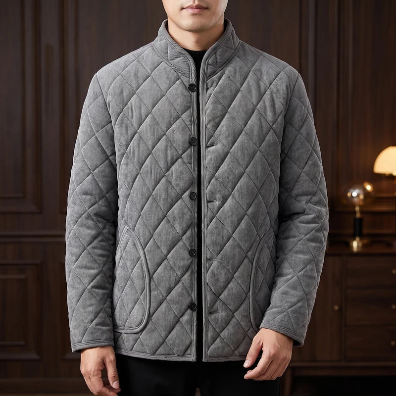 Grey fleece jacket in a dark wood interior
