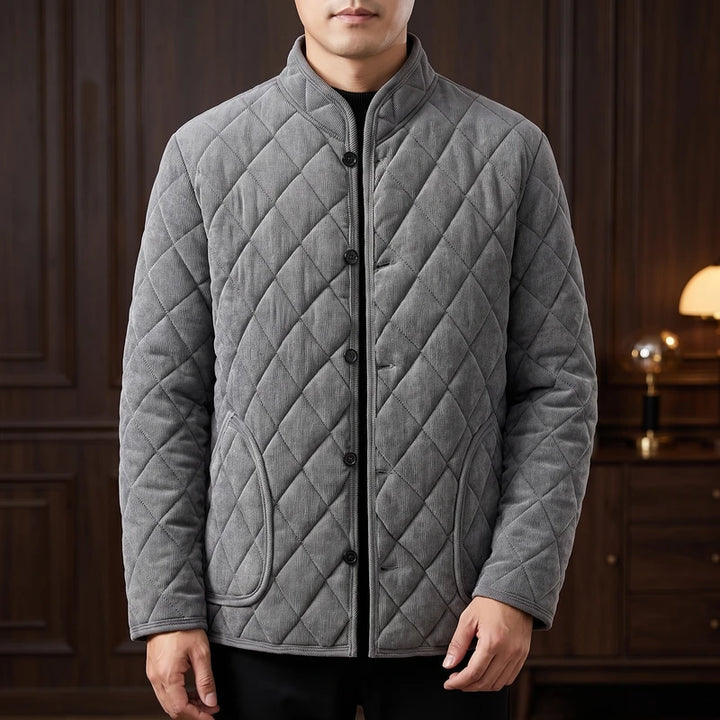 Grey fleece jacket in a dark wood interior