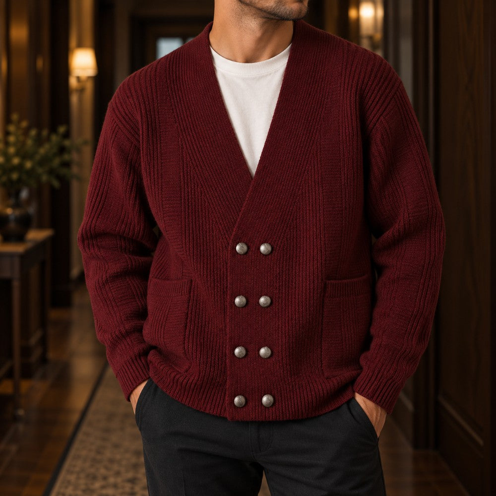 Man wearing a burgundy double-breasted ribbed knit cardigan with six silver buttons and two front pockets over a white tee.