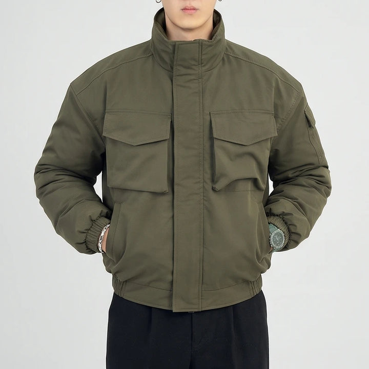 Green cotton jacket on an off-gray studio background