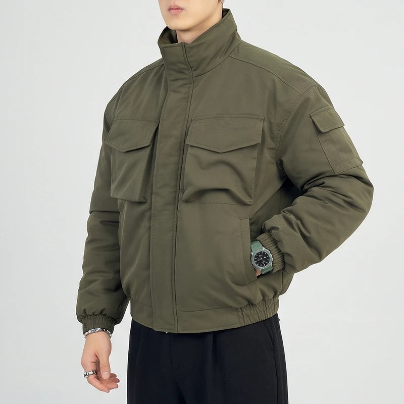 Green cotton jacket on an off-gray studio background - 2