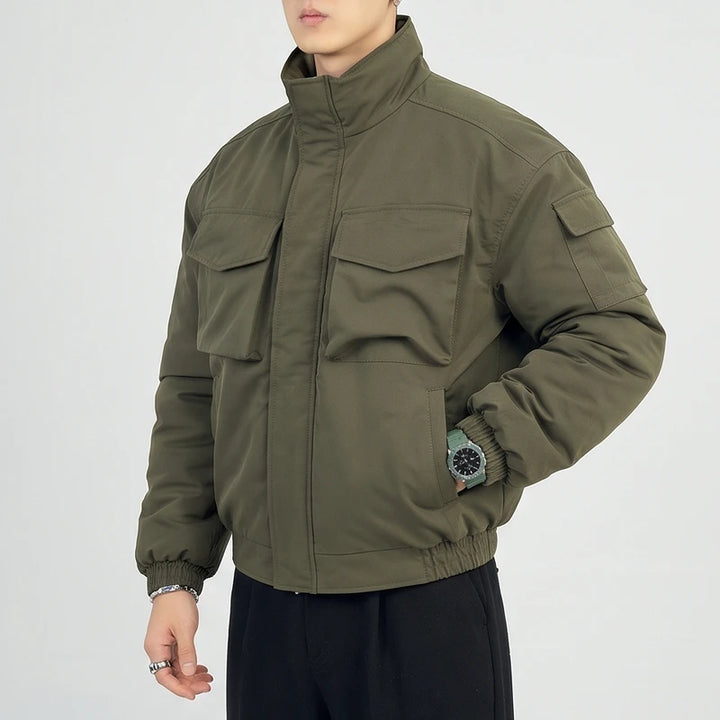 Green cotton jacket on an off-gray studio background - 2