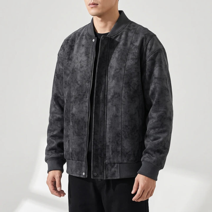 Black suede jacket on an off-gray studio background