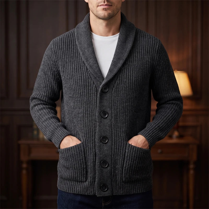 Gray knit cardigan in a dark wood interior