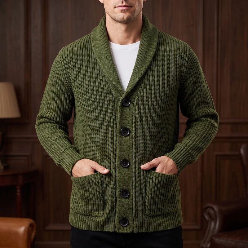 Green knit cardigan in a dark wood interior