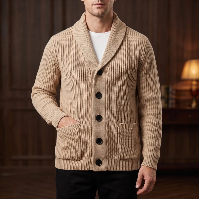 Khaki knit cardigan in a dark wood interior