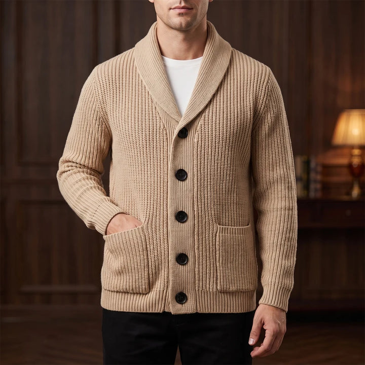 Khaki knit cardigan in a dark wood interior