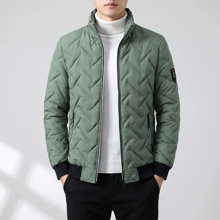 Green coats on an off-gray studio background