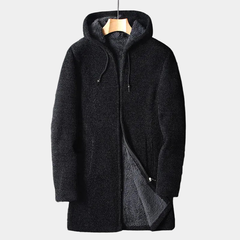 Black fleece coat with hood on a hanger against a light background