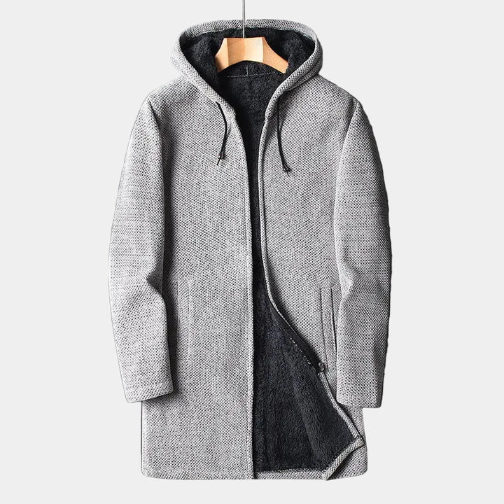 Gray hooded coat on a hanger against a light background