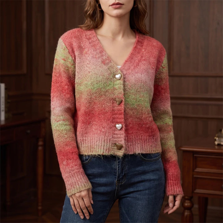 Red knitted sweater in a dark wood interior
