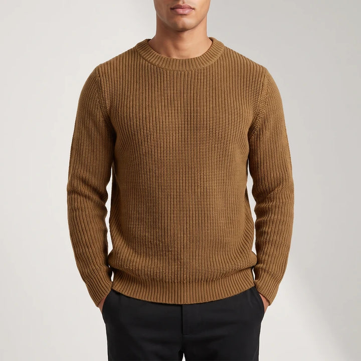 brown knitted top on an off-gray studio background