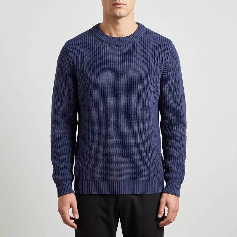 dark blue knitted top on an off-gray studio background