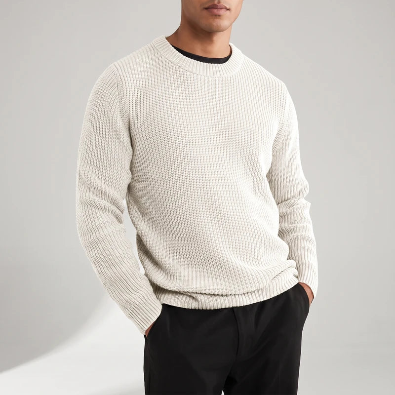 WHITE knitted top on an off-gray studio background