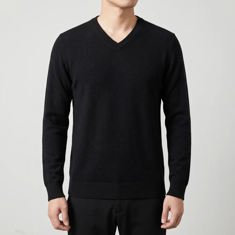 black knitted sweaters on an off-gray studio background