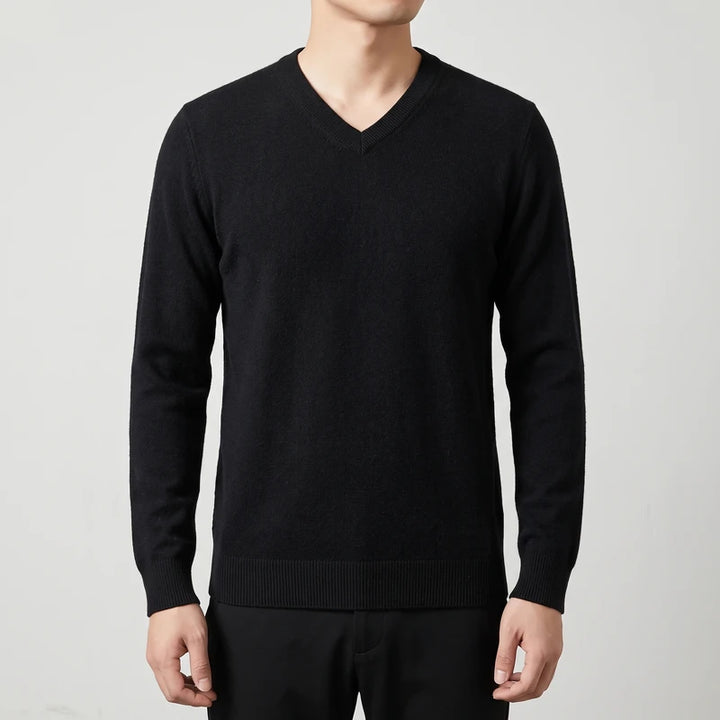 black knitted sweaters on an off-gray studio background