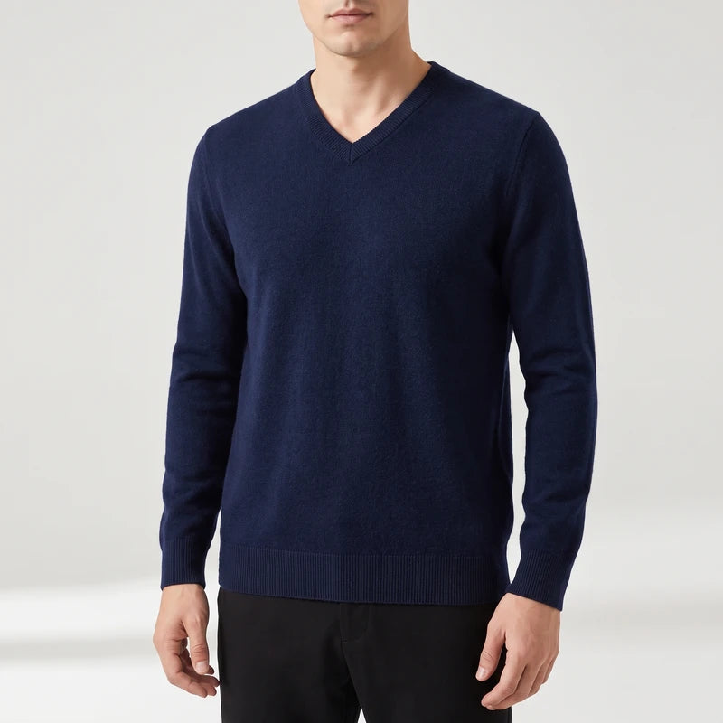 Navy Blue knitted sweaters on an off-gray studio background