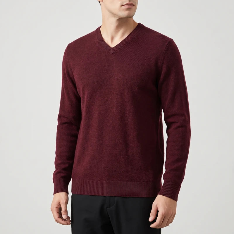 Red knitted sweaters on an off-gray studio background
